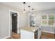 Bright kitchen featuring granite countertops, stylish pendant lighting and stainless dishwasher at 5100 Clay St, Denver, CO 80221