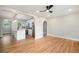 Bright living area showcases hardwood floors and access to the kitchen and other rooms at 5100 Clay St, Denver, CO 80221