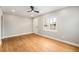 Inviting living room featuring beautiful hardwood floors, a ceiling fan, and a large window at 5100 Clay St, Denver, CO 80221