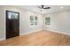 Bright living room featuring wood floors, modern ceiling fan, and natural light at 5100 Clay St, Denver, CO 80221