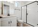 Modern bathroom with a sleek glass-enclosed shower, stylish vanity, and contemporary fixtures at 8145 Cokedale Cir, Littleton, CO 80125