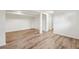 Spacious basement with new flooring, offering versatility and potential for various uses, from entertainment to storage at 5153 Tucson Way, Denver, CO 80239