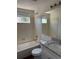 Bright bathroom features tiled shower-tub combination and vanity with granite countertop at 13959 Eudora St, Thornton, CO 80602