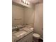 Updated half-bath with granite countertops and a modern sink basin at 13959 Eudora St, Thornton, CO 80602