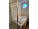 Enclosed tub and shower area offers privacy and style, enhanced by the adjacent octagonal window at 13959 Eudora St, Thornton, CO 80602