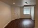 Spacious bedroom with hardwood flooring, a window, and a closet for ample storage at 13959 Eudora St, Thornton, CO 80602