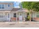 Charming townhome with inviting covered front porch and low-maintenance landscaping at 8260 Washington St # 78, Denver, CO 80229
