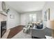 Comfortable living room with a charming fireplace, lots of natural light and stylish furnishings at 8260 Washington St # 78, Denver, CO 80229