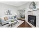 Inviting living room with a fireplace and an open view to the dining area for seamless entertaining at 8260 Washington St # 78, Denver, CO 80229