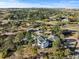 Spacious home surrounded by lush greenery, featuring a pool, shed, and solar panels on a sunny day at 9630 N Surrey Dr, Castle Rock, CO 80108