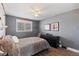 Bedroom boasts soft textures, a ceiling fan, and a view of the outside at 9630 N Surrey Dr, Castle Rock, CO 80108
