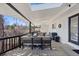 Inviting covered deck features comfortable seating, outdoor dining, and string lights at 9630 N Surrey Dr, Castle Rock, CO 80108