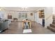 Dining room featuring hardwood floors, large windows, and modern decor at 9630 N Surrey Dr, Castle Rock, CO 80108
