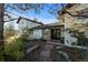 Inviting home exterior featuring stone accents and a charming walkway leading to the entrance at 9630 N Surrey Dr, Castle Rock, CO 80108