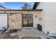 Charming front porch with stone accents, decorative door, and a welcoming welcome mat at 9630 N Surrey Dr, Castle Rock, CO 80108