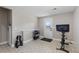 Bright home gym with ample space and a door to the backyard at 9630 N Surrey Dr, Castle Rock, CO 80108