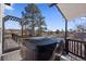 Enjoy outdoor relaxation with a hot tub on a deck offering a scenic view at 9630 N Surrey Dr, Castle Rock, CO 80108