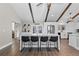 Stunning eat-in kitchen with a large island, stainless steel appliances, and beamed ceilings at 9630 N Surrey Dr, Castle Rock, CO 80108