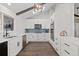 Modern kitchen with white cabinets, stainless steel appliances, and stylish backsplash at 9630 N Surrey Dr, Castle Rock, CO 80108