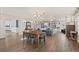 Spacious living room featuring hardwood floors, stone fireplace, and built-in bookshelves at 9630 N Surrey Dr, Castle Rock, CO 80108
