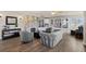 Cozy living room with stone fireplace, built-in bookshelves, and hardwood floors at 9630 N Surrey Dr, Castle Rock, CO 80108