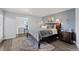 Spacious main bedroom featuring cozy rug, natural light and calm, cool wall colors at 9630 N Surrey Dr, Castle Rock, CO 80108