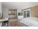 Open and bright primary bedroom flows into a bathroom and features a sliding glass door to the outside at 9630 N Surrey Dr, Castle Rock, CO 80108