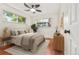 Staged bedroom with stylish decor and natural light at 1057 S Osceola St, Denver, CO 80219
