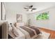 Staged bedroom with stylish decor, Queen bed and window with natural light at 1057 S Osceola St, Denver, CO 80219