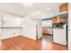 Kitchen features modern appliances and adjacent to the dining area at 1057 S Osceola St, Denver, CO 80219