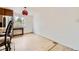Bright dining room featuring hardwood floors and a light fixture at 4934 S Flower Way, Littleton, CO 80123
