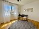 Bright home office with large window, hardwood floors, and modern decor at 4934 S Flower Way, Littleton, CO 80123