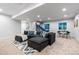 Spacious basement area featuring a comfortable sectional sofa and entertainment area at 1157 Jersey St, Denver, CO 80220
