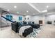 Basement area featuring a comfortable sectional sofa, basketball net and entertainment area at 1157 Jersey St, Denver, CO 80220