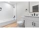 Clean bathroom features a shower/tub combo, white subway tile, and a marble countertop vanity at 1157 Jersey St, Denver, CO 80220