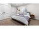 Cozy bedroom with a comfortable queen-sized bed, soft linens, and natural light from a window at 1157 Jersey St, Denver, CO 80220