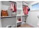 Organized closet features shelving and hanging racks, maximizing space for clothing and accessories at 1157 Jersey St, Denver, CO 80220