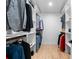Walk-in closet with organized shelves and rods, perfect for clothing and storage at 1157 Jersey St, Denver, CO 80220