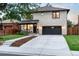 Beautiful two-story home boasting a stone facade, covered porch, and attached two-car garage at 1157 Jersey St, Denver, CO 80220
