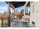Cozy front porch featuring stylish outdoor seating, a neutral rug, and views of the neighborhood at 1157 Jersey St, Denver, CO 80220