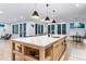 Large island with marble countertop and a great view of backyard at 1157 Jersey St, Denver, CO 80220