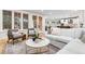 Bright living room features hardwood floors, large windows, and comfortable seating area at 1157 Jersey St, Denver, CO 80220
