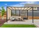 Backyard pergola with outdoor seating, artificial grass, and serene backyard views at Reunion Freunion F Mobile St, Commerce City, CO 80022