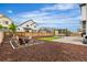 Large backyard featuring a fire pit, pergola with seating, and a well-maintained lawn at Reunion Freunion F Mobile St, Commerce City, CO 80022