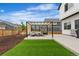 Outdoor oasis featuring a pergola with lounge seating and a well-manicured artificial lawn at Reunion Freunion F Mobile St, Commerce City, CO 80022