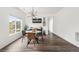 Open dining area with a round table, modern light fixture, and ample natural light at Reunion Freunion F Mobile St, Commerce City, CO 80022