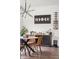 Bright dining room with a modern chandelier, stylish decor and table at Reunion Freunion F Mobile St, Commerce City, CO 80022