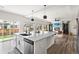 Open concept kitchen with a large island, stainless steel dishwasher and appliances at Reunion Freunion F Mobile St, Commerce City, CO 80022