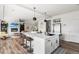 Bright, open kitchen with a large island, modern appliances, and seamless flow at Reunion Freunion F Mobile St, Commerce City, CO 80022