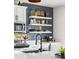 Bright kitchen showcasing stainless steel microwave, open shelves on a blue tiled backsplash, and black faucet at Reunion Freunion F Mobile St, Commerce City, CO 80022